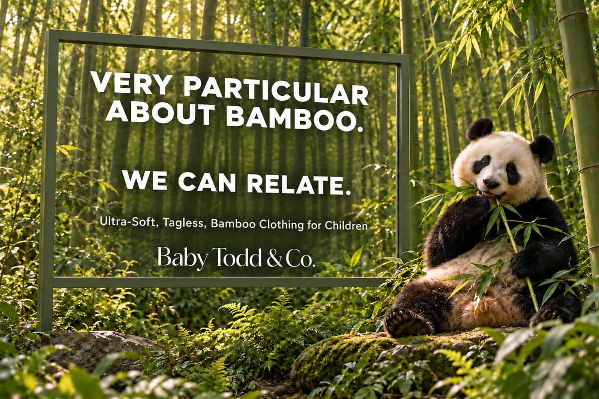 A panda sits on a log in a bamboo forest holding bamboo, next to a large sign that reads 'VERY PARTICULAR ABOUT BAMBOO. WE CAN RELATE.